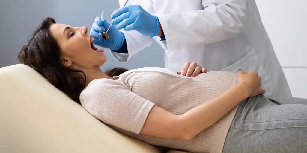 Female getting dental check up